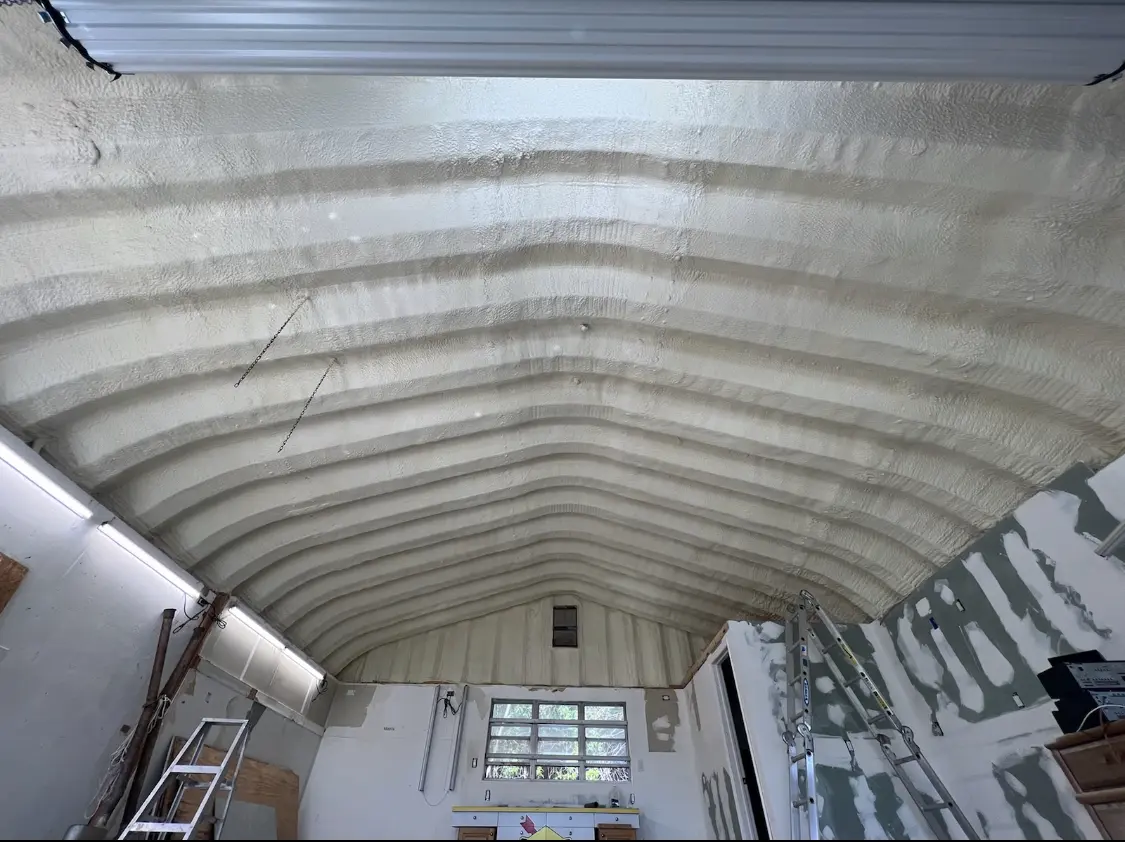 Spray polyurethane foam applied to the underside of a metal roof deck in Euless